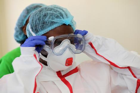 20200306-BOXRAFT-A medical practitioner dresses in protective gear at Coronavirus isolation an...jpg
