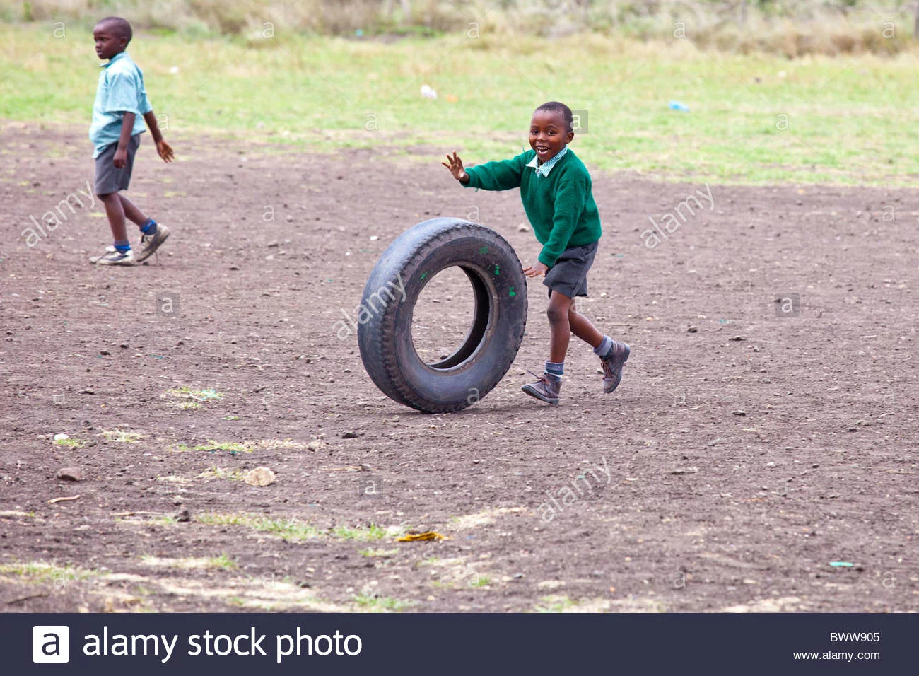 boy-rolling-a-tire-maji-mazuri-centre-and-school-nairobi-kenya-BWW905.webp