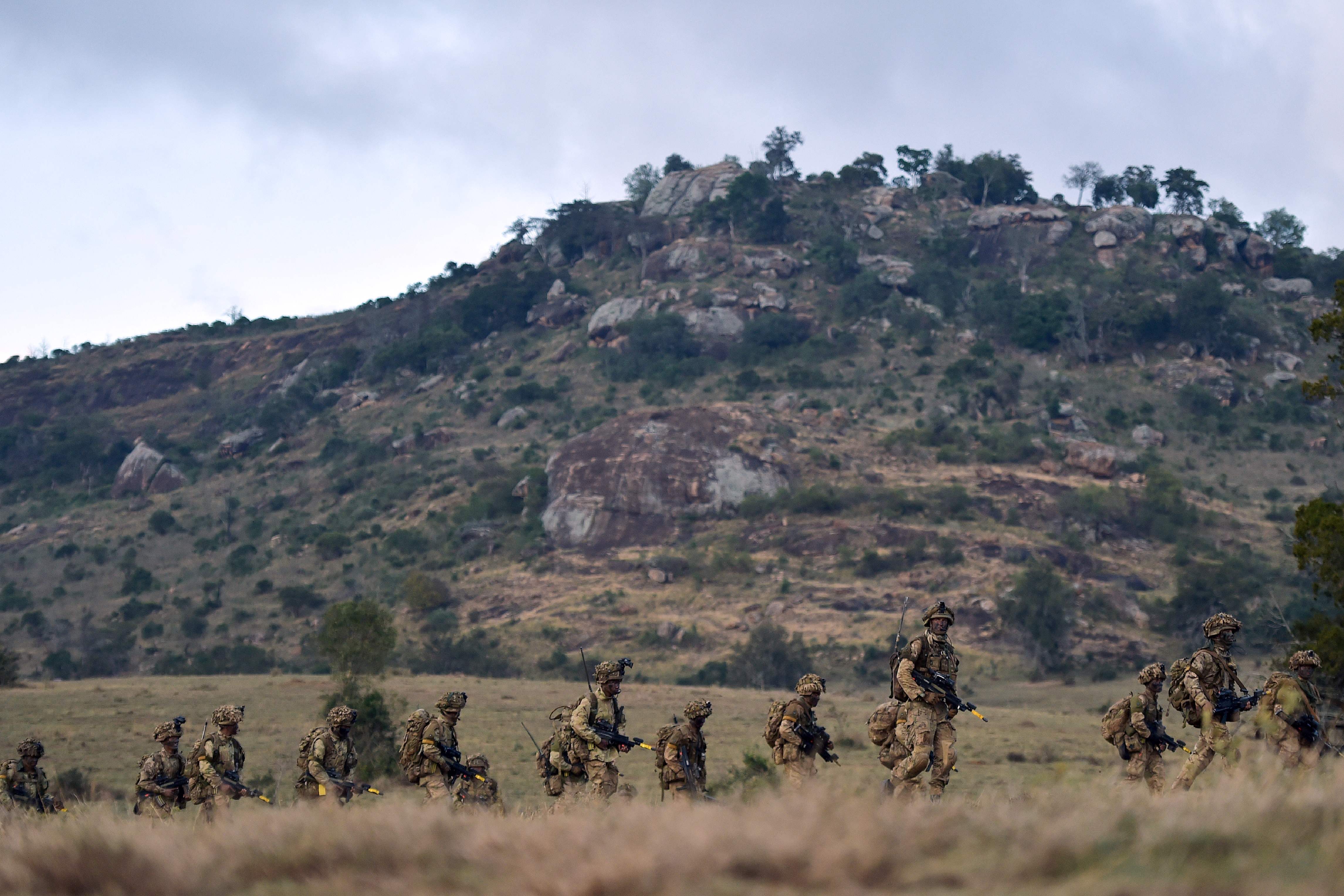 A company of soldiers troop during a simulated military exercise of the British Army Training Unit in Kenya (file image)